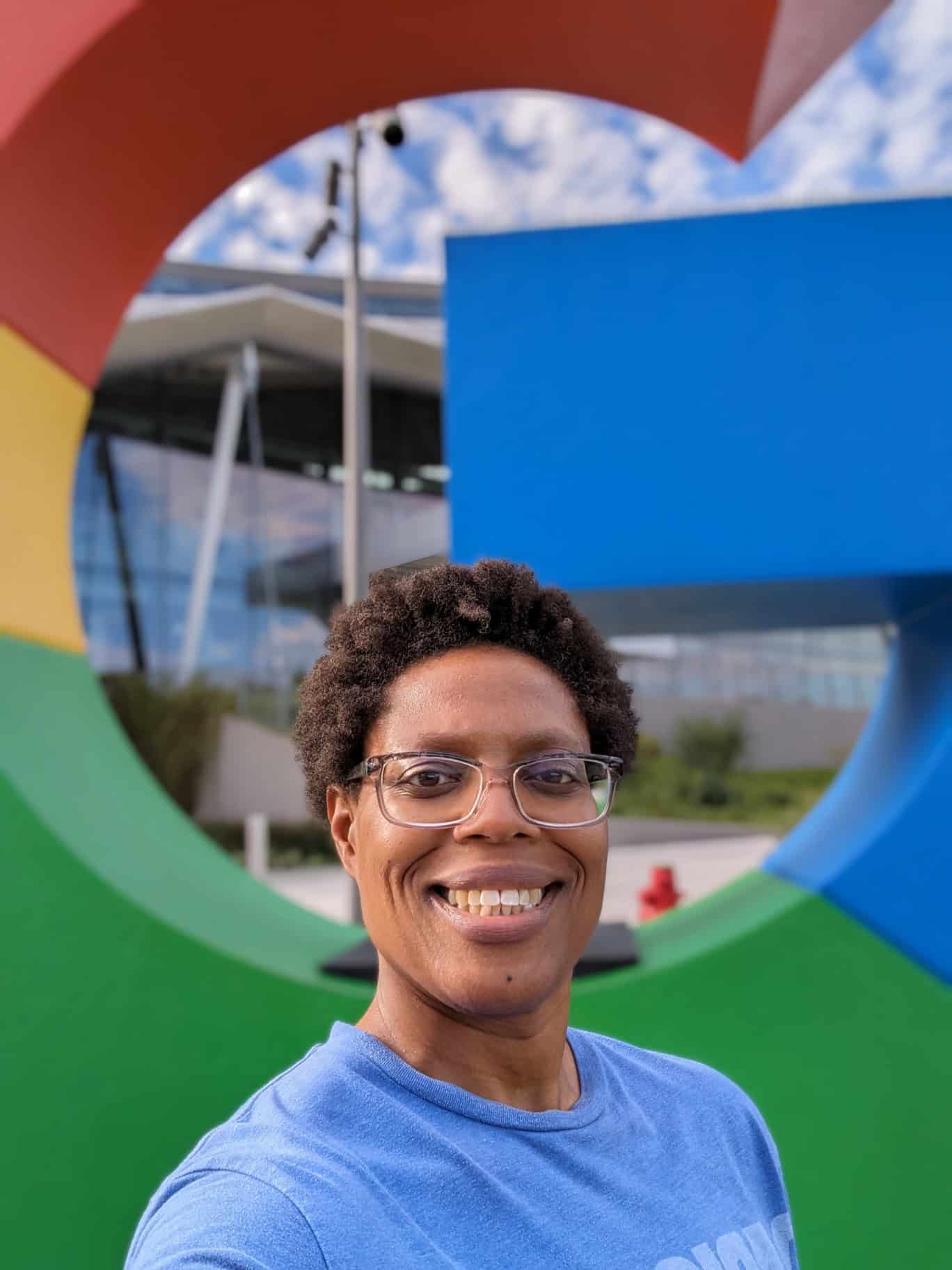 Brittany Gates standing before the Google logo.
